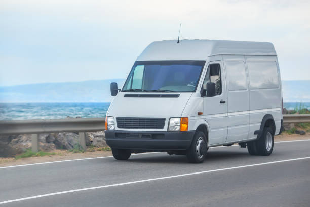 istock Mini bus moves along the seashore 1667646263