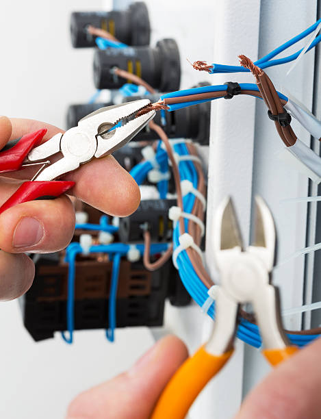 istock Hand of an electrician 166764926
