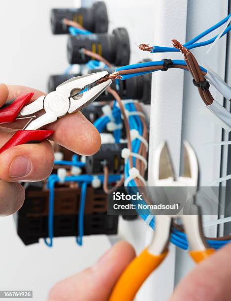 Hand Of An Electrician Stock Photo - Download Image Now - Adult, Assistance, Blue-collar Worker