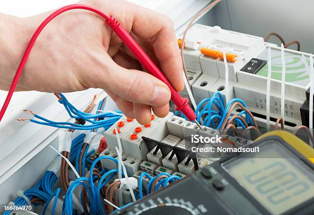 Hand Of An Electrician Stock Photo - Download Image Now - Electricity, Electrician, Machinery