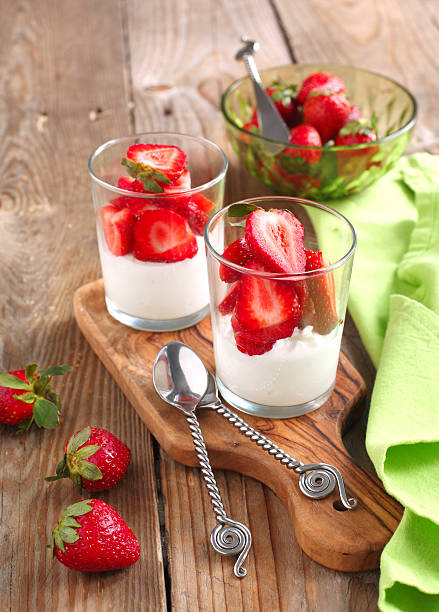 istock Cottage cheese with strawberries in small glass cup 166766359