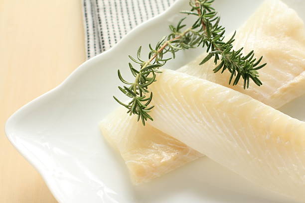 istock freshness flat fish on dish with rosemary 166766457