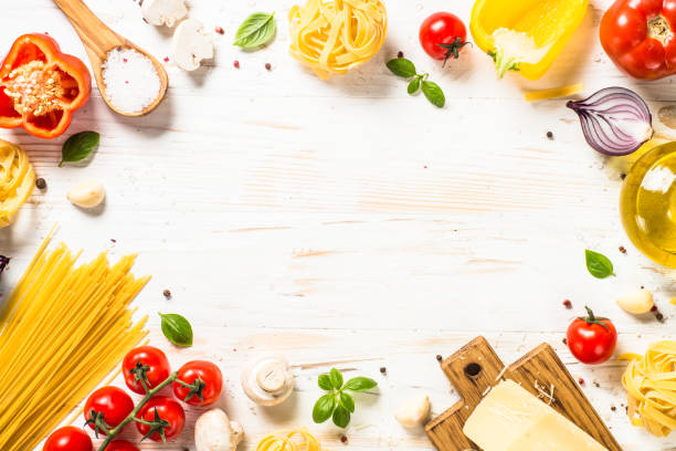 istock Italian food background at white bkitchen table. 1667682809