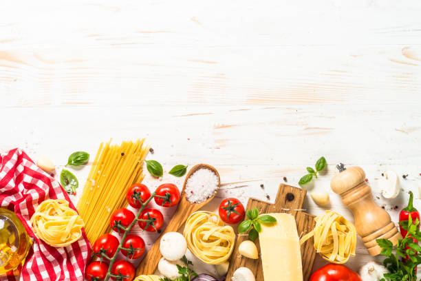 istock Italian food background at white bkitchen table. 1667682813