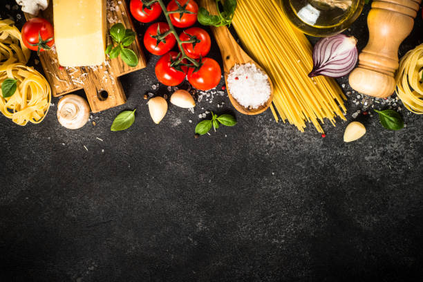 istock Italian food background at white bkitchen table. 1667683337
