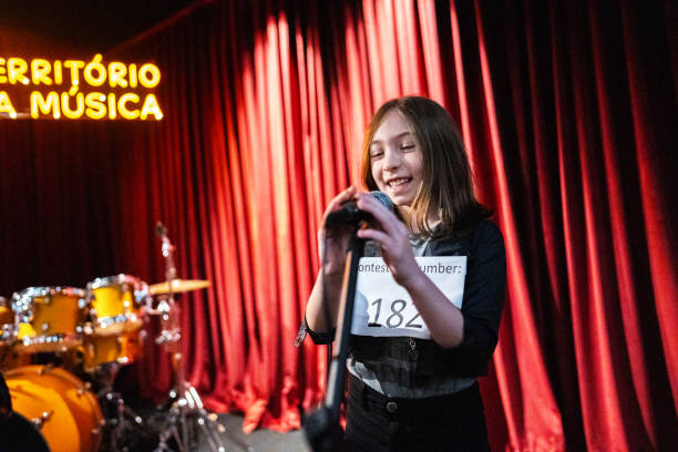 istock Girl singing in a music contest 1667683348
