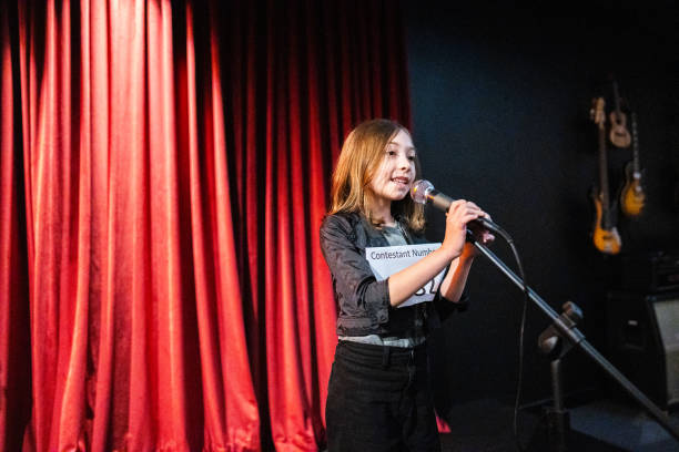 istock Girl singing in a music contest 1667683888