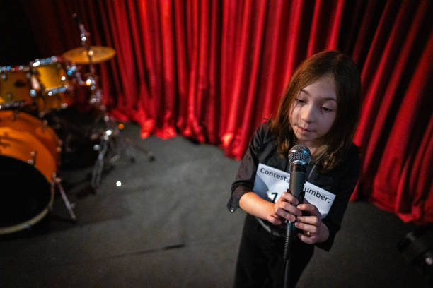 istock Girl singing in a music contest 1667683917