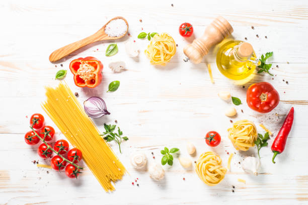 istock Italian food frame on white kitchen table. 1667683923
