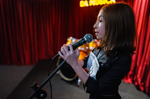 Girl singing in a music contest