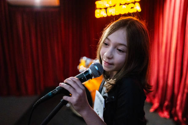 istock Girl singing in a music contest 1667684440