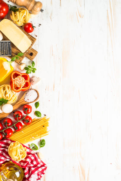 istock Italian food background at white bkitchen table. 1667684483