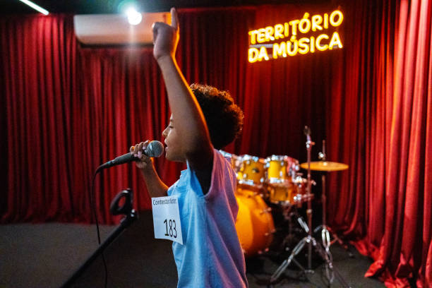 istock Boy singing in a music contest 1667686129
