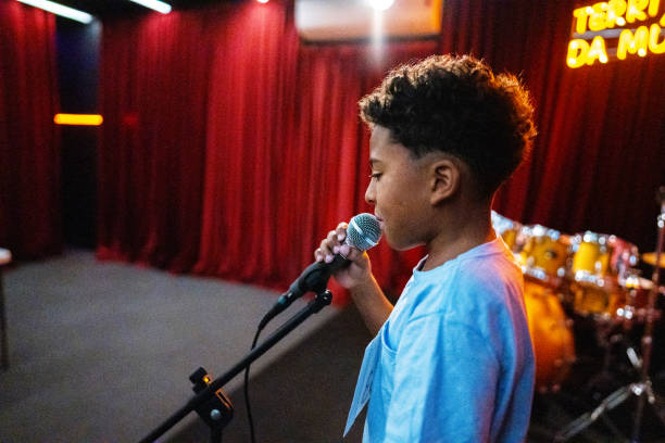 istock Boy singing in a music contest 1667686130