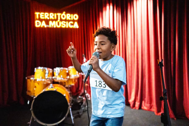 istock Boy singing in a music contest 1667686133