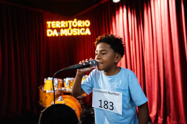 istock Boy singing in a music contest 1667687778
