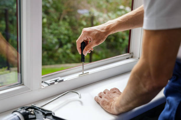 istock worker adjusting plastic PVC window. maintenance and repair. banner with copy space 1667688930