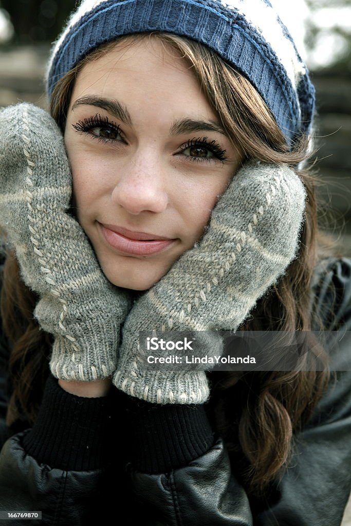 Teen Girl in Winter Woollies A portrait of a beautiful teenage girl wearing a toque and woolen mittens. 14-15 Years Stock Photo