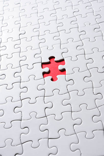 istock Missing piece of blank white Jigsaw puzzle against red background 166769964