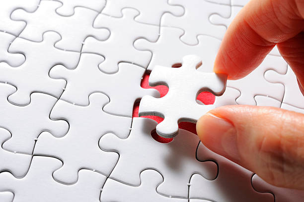 istock Holding a white blank final piece of the jigsaw 166769966