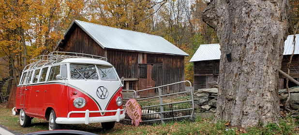 Newburgh, United States outside a vintage Volkswagon bus is parked outside an old fashioned wooden barn in rural New York State.