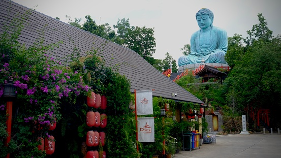 July 24 2023, Lampang, Thailand : Daibutsu big buddha statue in Wat Phra That Doi Phra Chan, famous temple Japanese  style.