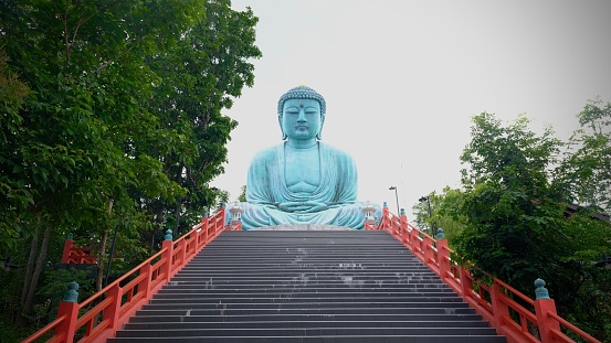 July 24 2023, Lampang, Thailand : Daibutsu big buddha statue in Wat Phra That Doi Phra Chan, famous temple Japanese  style.