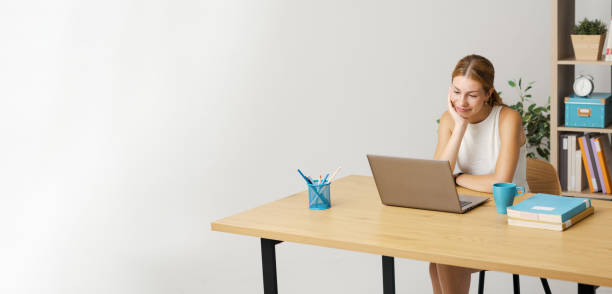 istock Young woman connecting with her laptop 1667723888
