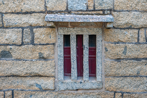 The distinctive doors and windows of stone houses by the seaside