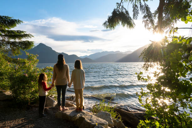 istock Mother and daughters bonding in nature 1667767170