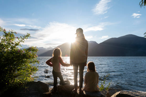istock Mother and daughters bonding in nature 1667767172