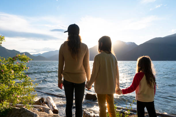 istock Mother and daughters bonding in nature 1667767349