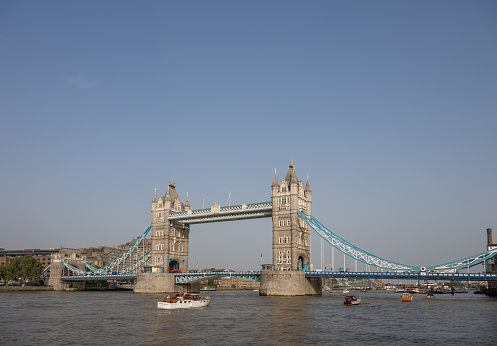 London, UK: Tower Bridge, a famous landmark in London. The bridge crosses the River Thames near to the Tower of London and was completed in 1894. With copy space.