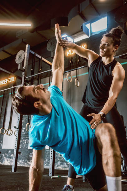 istock a female personal trainer gives classes at the gym 1667776755