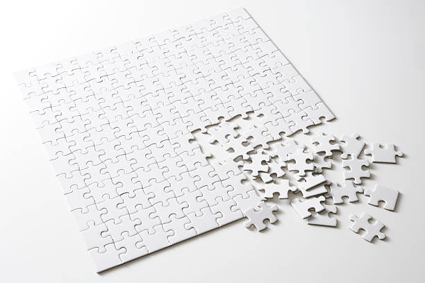 Isolated shot of blank square jigsaw puzzle on white background