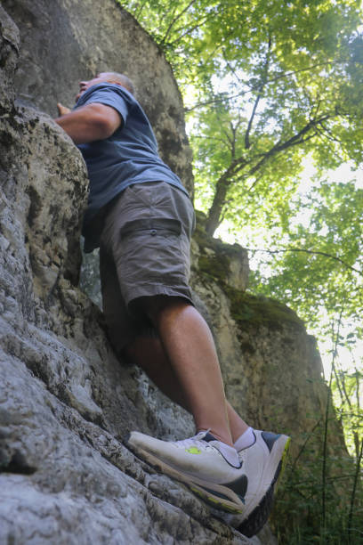 istock A man climbs a rock. Free climbing. 1667783346