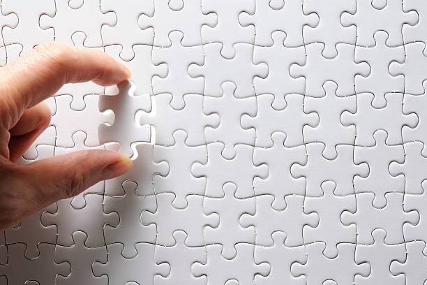 istock Holding a blank final piece of the jigsaw 166780399