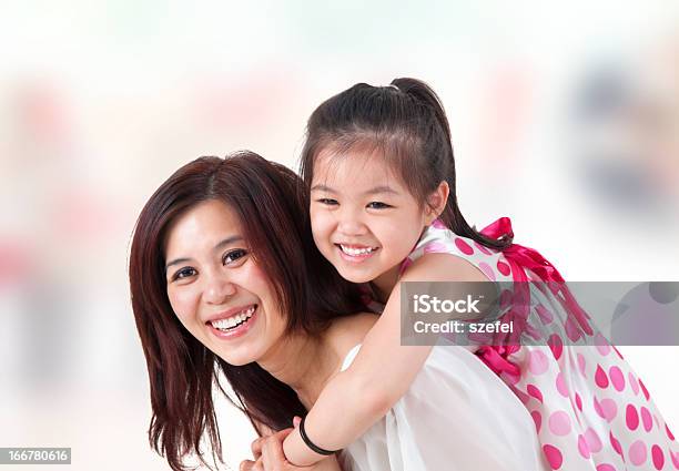 Asian Family Piggyback Ride At Home Stock Photo - Download Image Now - Adult, Asian and Indian Ethnicities, Back