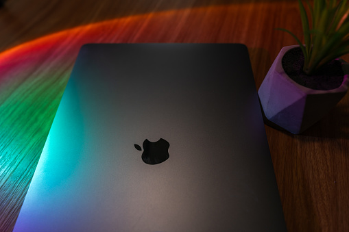 Laptop back with colorful lights - Apple Macbook pro computer
| Abu Dhabi, UAE, August 27, 2023