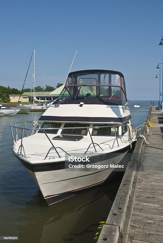Motorboat Motorboat at the Port Credit marina Commercial Dock Stock Photo