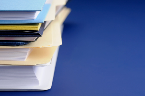 Stock photo of a stack of paperwork and folders