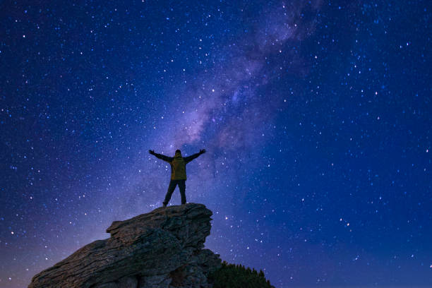 Man looking at the night sky