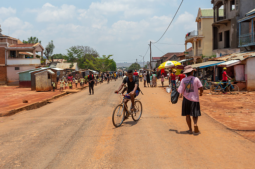Motorcycle traffic in busy streets of African town.