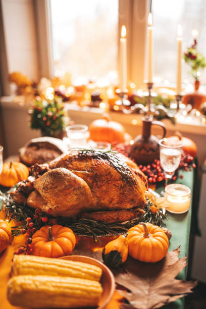 istock Thanksgiving holiday dinner table setting with fall decoration and pumpkins 1667836151