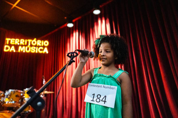 istock Girl singing in a music contest 1667838893