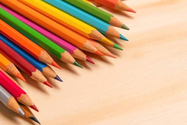 WOODEN PENCILS OF VARIOUS COLORS, FROM TOP LEFT CORNER. COLOR. HORIZONTAL.