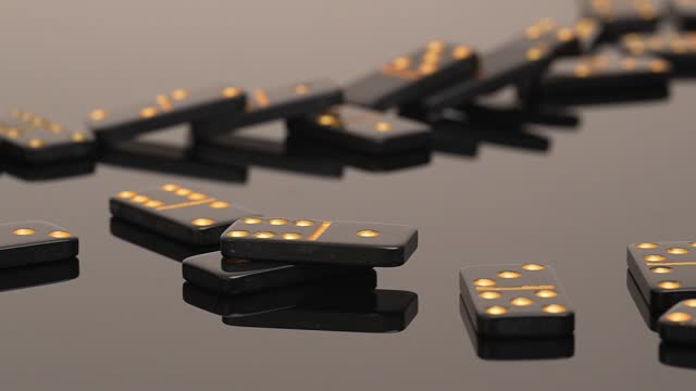 Falling Glossy Black Dominoes on a glass table