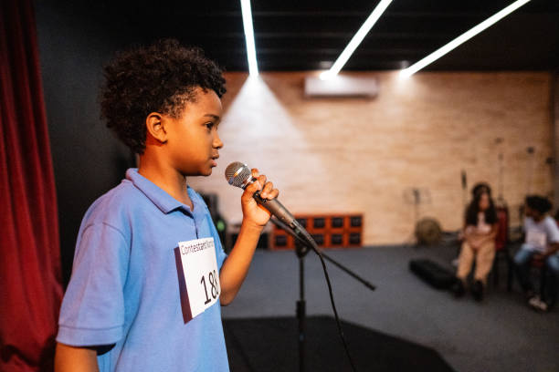 istock Boy singing in a music contest 1667871857