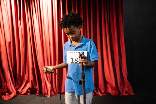 istock Boy preparing to sing in a music contest 1667871858