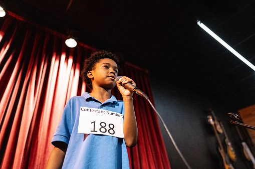 Boy singing in a music contest
